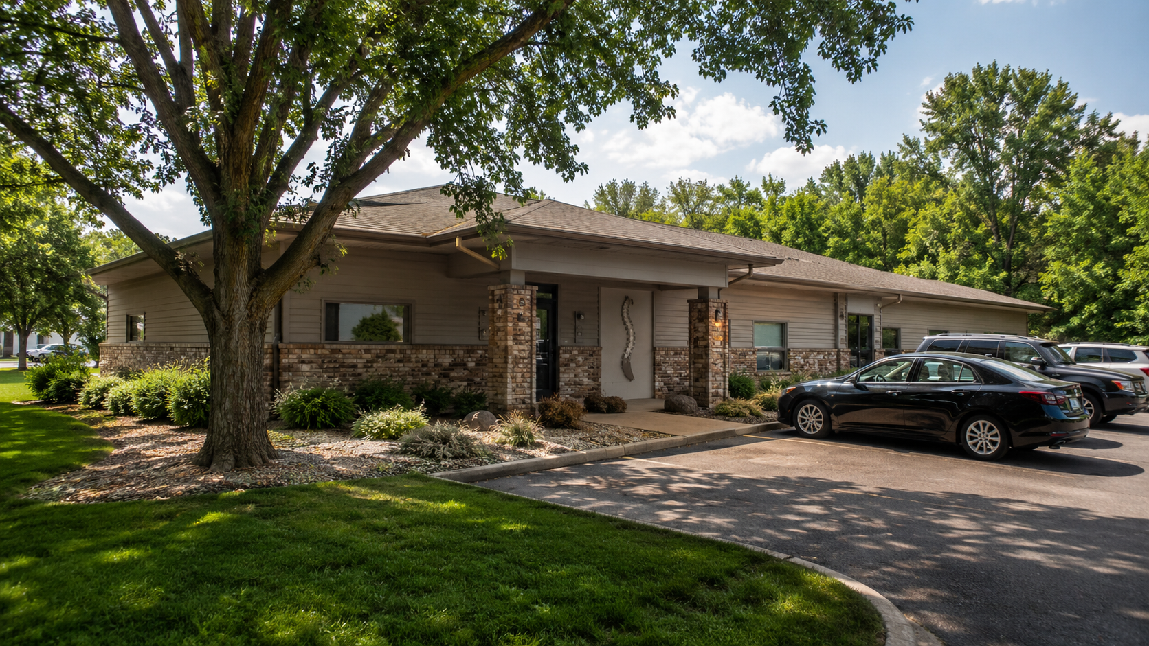 modern chiropractic clinic exterior in Andover Minnesota on a sunny day with landscaped surroundings